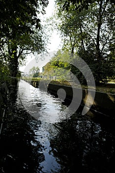 Canal in a park with fluent water