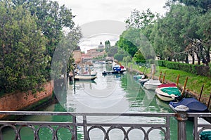 Canal in a public park Giardini in Venice