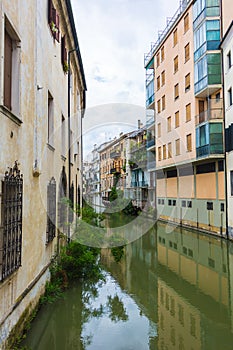 Canal San Massimo runs among residential houses