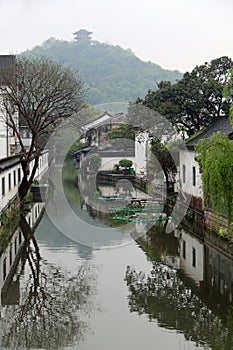 Reflections in a canal in the city of Shaoxing, Zhejiang, China photo