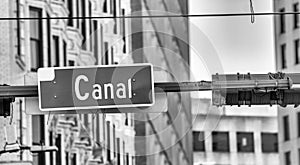 Canal Street sign with beads in New Orleans after Mardi Gras Parade