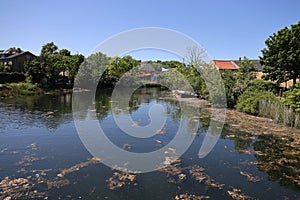 The canal that surrounds the fortifications of the Christiania neighborhood in Copenhagen photo