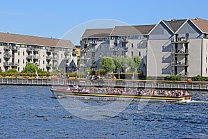 Canal tourboat on sightseeing trip on canal in Copenhagen, Denmark