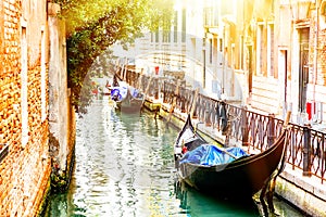 Canal with two gondolas in Venice, Italy. Architecture and landmarks of Venice. Summer sunny day in Venice.