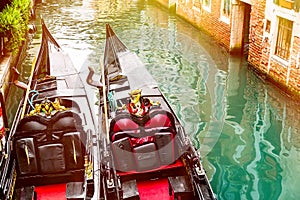 Canal with two gondolas in Venice, Italy. Architecture and landmarks of Venice. Summer sunny day in Venice.