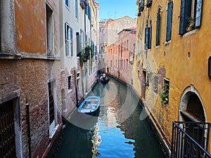 Canal with two gondolas in Venice, Italy. Architecture and landmarks of Venice. Venice postcard with Venice gondolas