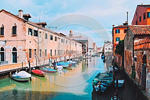 canal in Venice Italy and residents \' boats