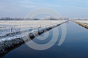 Canal in a white winter landscape