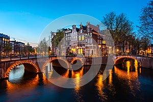 Canals of Amsterdam at night. Amsterdam is the capital and most populous city of the Netherlands photo