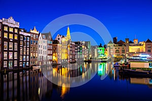 Canals and tradition house in Amsterdam at night. Amsterdam is the capital and most populous city of the Netherlands photo