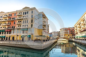 Canals of Venice like Qanat Quartier at the Pearl in Doha, Qatar in a late afternoon. photo
