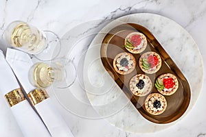 canape with black caviar and soured cream near