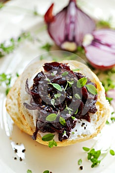 Canape with caramelized onion chutney and creamy goat cheese