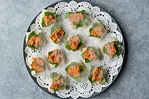 Canape with Muhammara, Adjika, Ajika or Acuka on Small Square Breads with Round Plate.