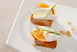 Canape with orange and blue cheese photo