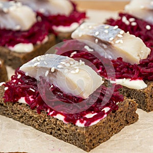 Canape with a pickled herring and beetroot