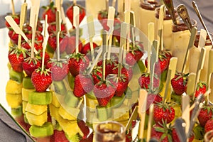 Canape on skewers with strawberry kiwi and pineapple