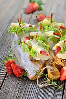 Canapes with cheese and strawberries