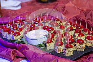 canapes with cherry tomato and cream on frua buffet table