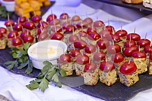 canapes with cherry tomato and cream on frua buffet table