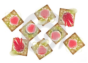 Canapes with grape, strawberry, jelly and creme