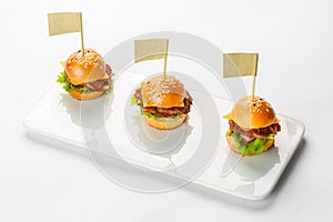Canapes mini sandwich on glass dish on a white background. Catering service