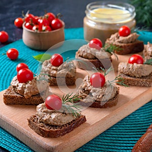 Canapes with rye bread, liver pate, cherry tomatoes. Breakfast snack