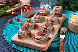 Canapes with rye bread, liver pate, cherry tomatoes. Breakfast snack