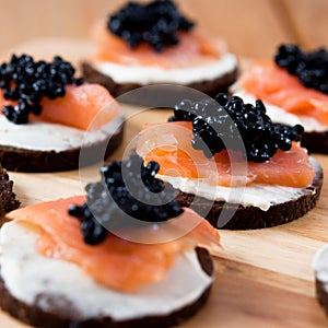 Canapes with salmon and caviar