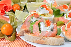 Canapes with salmon and caviar