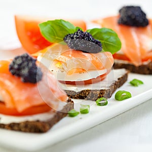 Canapes with smoked salmon and caviar