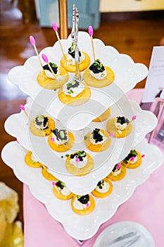 Canapes with smoked salmon and caviar