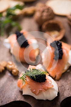 Canapes with smoked salmon and caviar