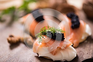 Canapes with smoked salmon and caviar