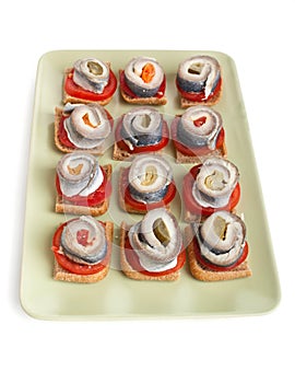 Canapes with tomatoes and norwegian herring