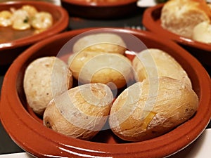 Canarian potatos with salt and skin on in a terracotta Spanish dish