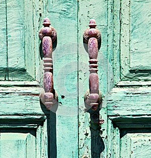 canarias brass knocker in a green closed photo