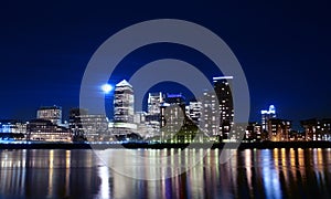 Canary wharf across the Thames at night photo