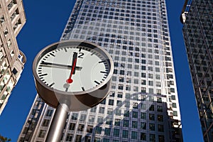 Canary Wharf clock and skyscrapers in the financial center of Lo