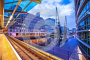 Canary Wharf financial district of London skyscrapers and canal evening view, West India Quay