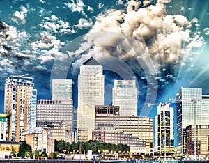 Canary Wharf night skyline over river Thames - London, UK