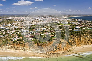 Canavial Beach. Southern golden coast cliffs. Aerial view over city of Lagos Algarve, Portugal