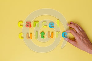 Cancel culture cancellation and social networks. Letters on a yellow background. Cancel a cultural symbol