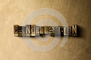 CANCELLATION - close-up of grungy vintage typeset word on metal backdrop