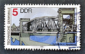 Cancelled postage stamp printed by East Germany, that shows Drawbridge in Magdeburg