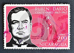 Cancelled postage stamp printed by Nicaragua, that shows Ruben Dario and Saint Francis and the Wolf