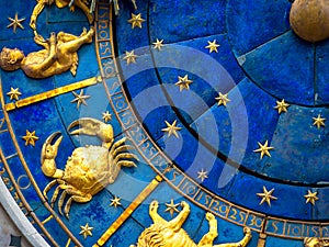 Cancer astrological sign on ancient clock. Detail of Zodiac wheel with crab