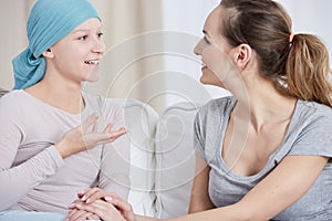 Cancer patient talking with friend