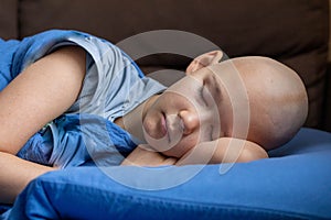 Cancer patient teen girl lying in the bed and sleeping