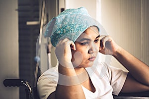 Cancer patients women sitting on a wheelchair photo